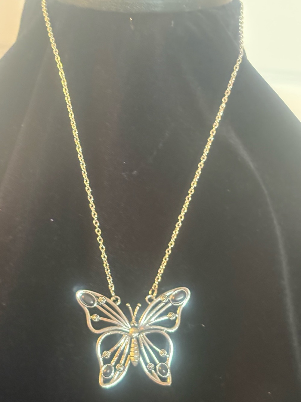 Silver Butterfly Pendant Necklace with black stones at the tip of wings